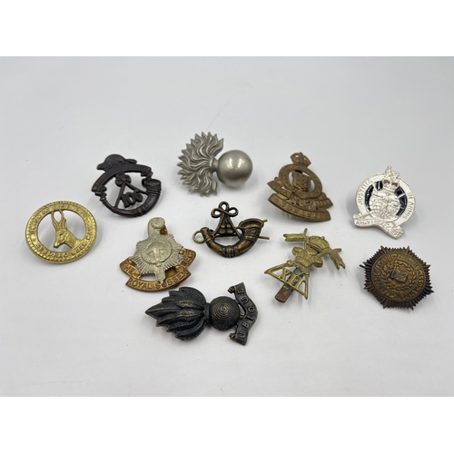 2242 - Ten military cap badges to include Winnipeg Light Infantry, Army Legal Corps, The Royal Sussex Regim... 