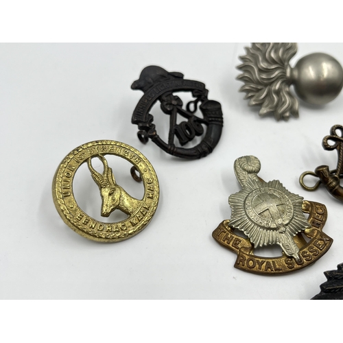 2242 - Ten military cap badges to include Winnipeg Light Infantry, Army Legal Corps, The Royal Sussex Regim... 