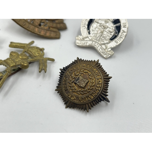 2242 - Ten military cap badges to include Winnipeg Light Infantry, Army Legal Corps, The Royal Sussex Regim... 