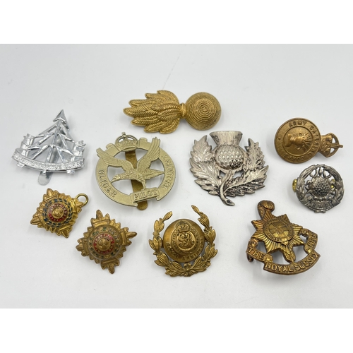 2243 - Ten military cap badges to include The Royal Sussex Regiment, Glider Pilot Regiment, Royal Engineers... 