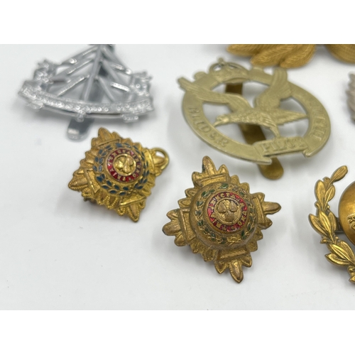 2243 - Ten military cap badges to include The Royal Sussex Regiment, Glider Pilot Regiment, Royal Engineers... 