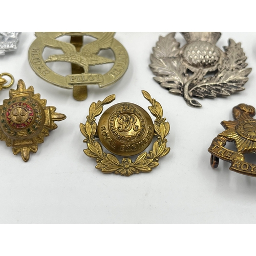 2243 - Ten military cap badges to include The Royal Sussex Regiment, Glider Pilot Regiment, Royal Engineers... 