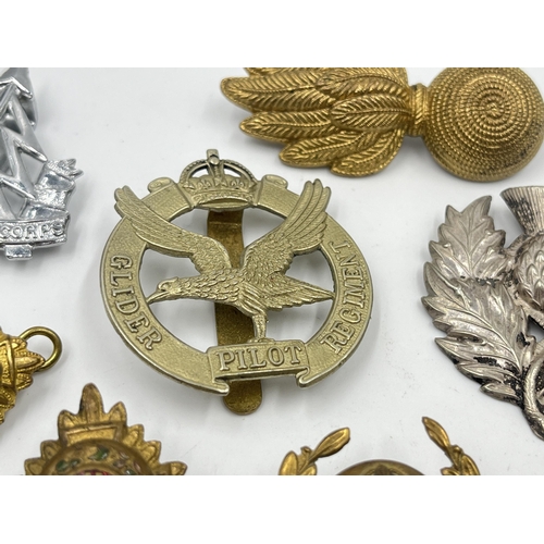 2243 - Ten military cap badges to include The Royal Sussex Regiment, Glider Pilot Regiment, Royal Engineers... 