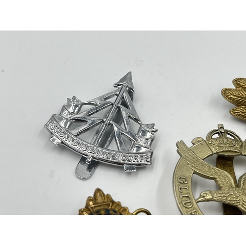 2243 - Ten military cap badges to include The Royal Sussex Regiment, Glider Pilot Regiment, Royal Engineers... 