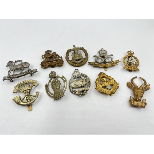 2244 - Ten military cap badges to include Royal Berkshire, Dorset, Jellalabad, South Staffordshire, East La... 