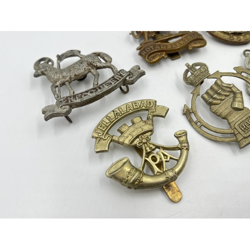 2244 - Ten military cap badges to include Royal Berkshire, Dorset, Jellalabad, South Staffordshire, East La... 