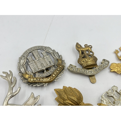 2245 - Ten military cap badges to include The Buffs, The Royal Dragoons, Northamptonshire, Kaffrarian Rifle... 