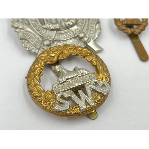 2246 - Ten military cap badges to include Scottish King's Borderers Own, The Royal Dragoons, Metropolitan S... 