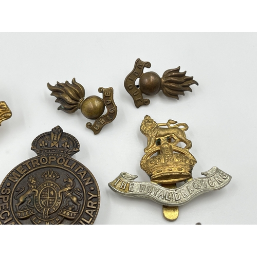 2246 - Ten military cap badges to include Scottish King's Borderers Own, The Royal Dragoons, Metropolitan S... 