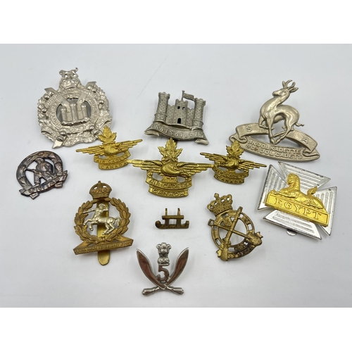 2247 - Twelve military cap badges to include Air Cadets Canada, South African School Cadets, Royal Army Vet... 