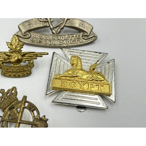 2247 - Twelve military cap badges to include Air Cadets Canada, South African School Cadets, Royal Army Vet... 