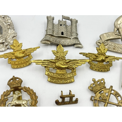 2247 - Twelve military cap badges to include Air Cadets Canada, South African School Cadets, Royal Army Vet... 