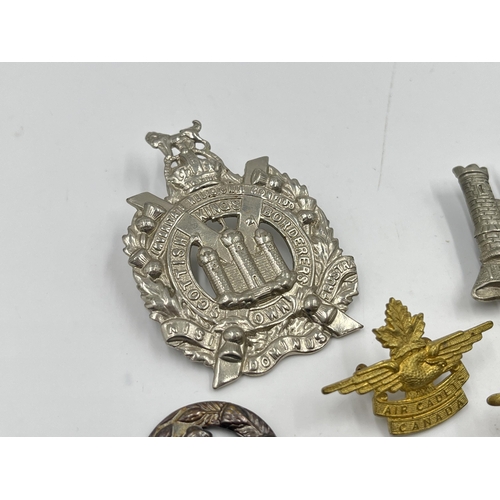 2247 - Twelve military cap badges to include Air Cadets Canada, South African School Cadets, Royal Army Vet... 