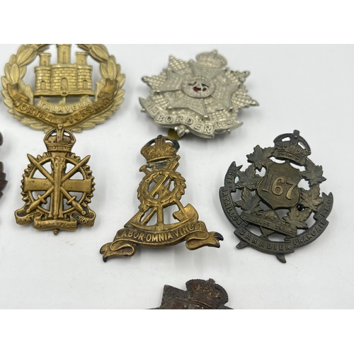 2248 - Ten military cap badges to include East Surrey, Northamptonshire, The Border Regiment, The Yorkshire... 