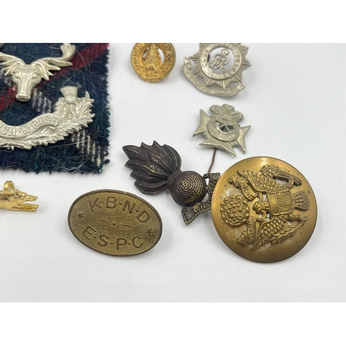 2249 - A collection of military badges to include Canadian Garrison Regiment, North Somerset Yeomanry etc.