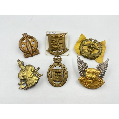 2252 - Six military cap badges to include South African Technical Service Corps, WWI On War Service 1915, S... 