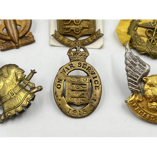 2252 - Six military cap badges to include South African Technical Service Corps, WWI On War Service 1915, S... 