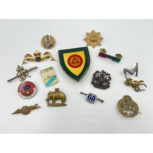 2255 - A collection of military badges to include Derbyshire Air Raid Welfare, Royal Navy, Duke of Wellingt... 