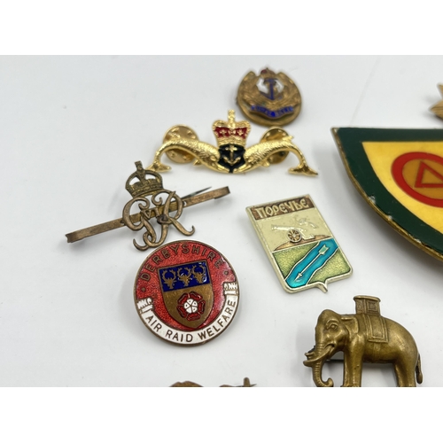 2255 - A collection of military badges to include Derbyshire Air Raid Welfare, Royal Navy, Duke of Wellingt... 