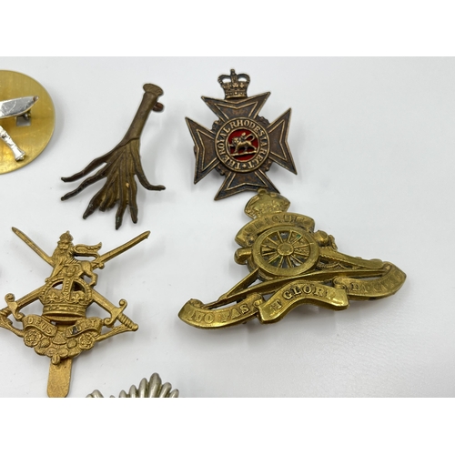 2260 - Ten military cap badges to include Middlesex Regiment, The Royal Scots, Dorsetshire etc.