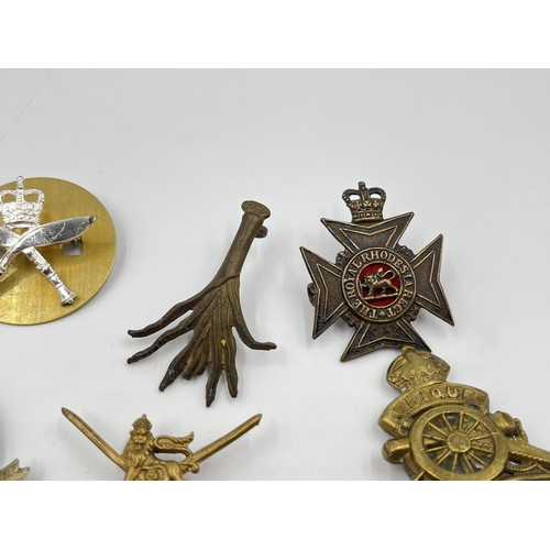 2260 - Ten military cap badges to include Middlesex Regiment, The Royal Scots, Dorsetshire etc.