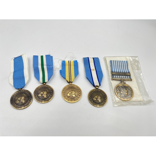 2262 - Five United Nations service medals to include one with Korea clasp etc.