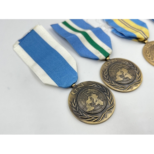 2262 - Five United Nations service medals to include one with Korea clasp etc.