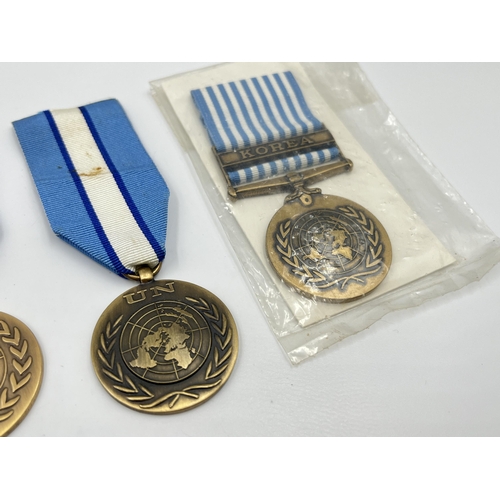 2262 - Five United Nations service medals to include one with Korea clasp etc.