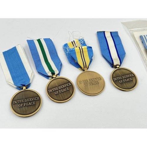 2262 - Five United Nations service medals to include one with Korea clasp etc.