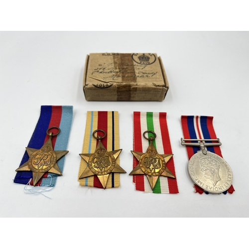 2269 - Four WWII medals, War, The Africa Star, The 1939-1945 Star and The Italy Star with ribbons and box