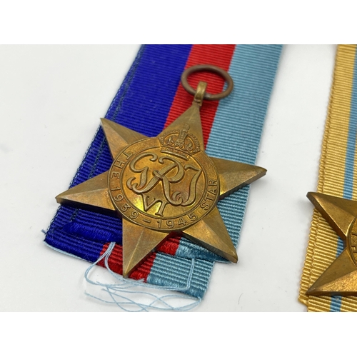 2269 - Four WWII medals, War, The Africa Star, The 1939-1945 Star and The Italy Star with ribbons and box