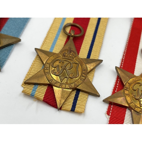 2269 - Four WWII medals, War, The Africa Star, The 1939-1945 Star and The Italy Star with ribbons and box