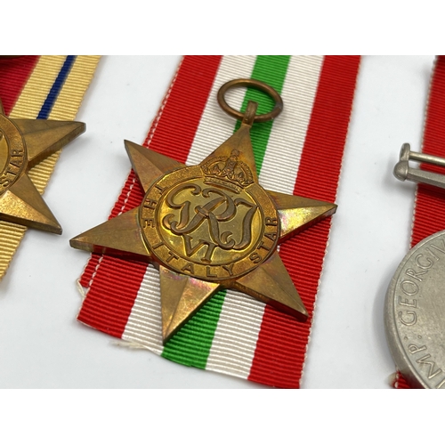 2269 - Four WWII medals, War, The Africa Star, The 1939-1945 Star and The Italy Star with ribbons and box