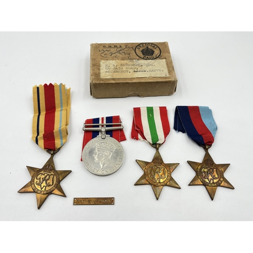 2273 - Four WWII medals, The 1939-1945 Star, War, The Africa Star and The Italy Star with box