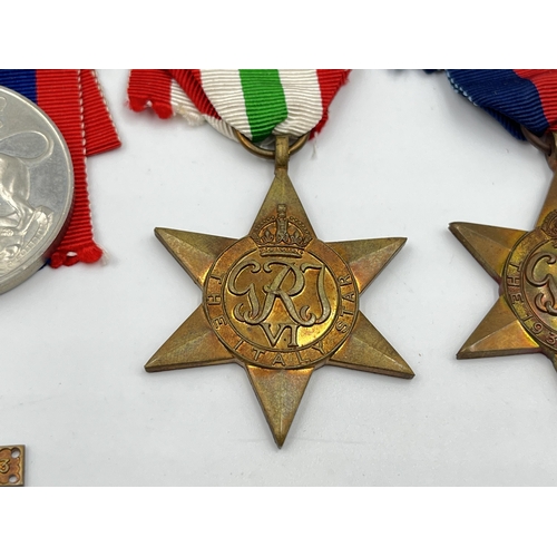 2273 - Four WWII medals, The 1939-1945 Star, War, The Africa Star and The Italy Star with box