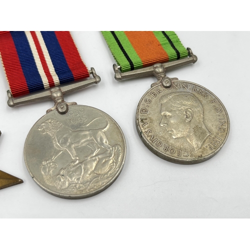 2275 - Four WWII medals, The Defence, War, The 1939-1945 Star and The France and Germany Star with document... 