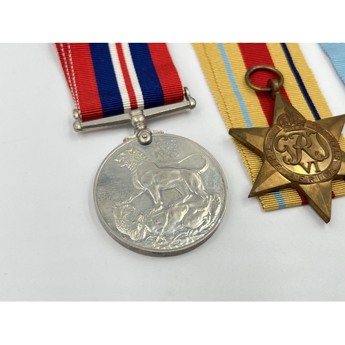 2280 - Four WWII medals, The Defence, War, The 1939-1945 Star and The Africa Star with documents and box