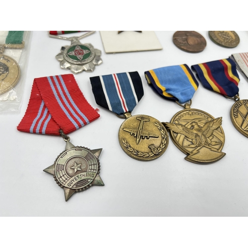 2281 - A collection of medals to include Poland Prison Service, North Vietnam Resolution for Victory 1st Cl... 