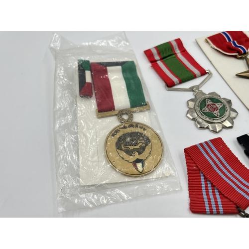 2281 - A collection of medals to include Poland Prison Service, North Vietnam Resolution for Victory 1st Cl... 