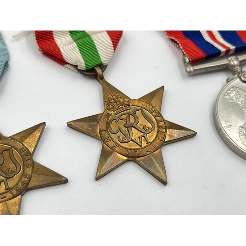 2289 - Five WWII medals comprising Italy, Africa and 1939-45 Stars, Defence and Victory together with WWII ... 