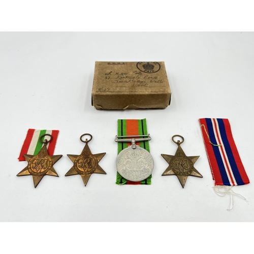 2290 - Four WWII medals, The Defence, The 1939-1945 Star, The Italy Star and The Africa Star with document ... 