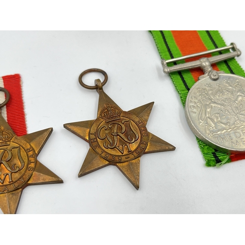 2290 - Four WWII medals, The Defence, The 1939-1945 Star, The Italy Star and The Africa Star with document ... 