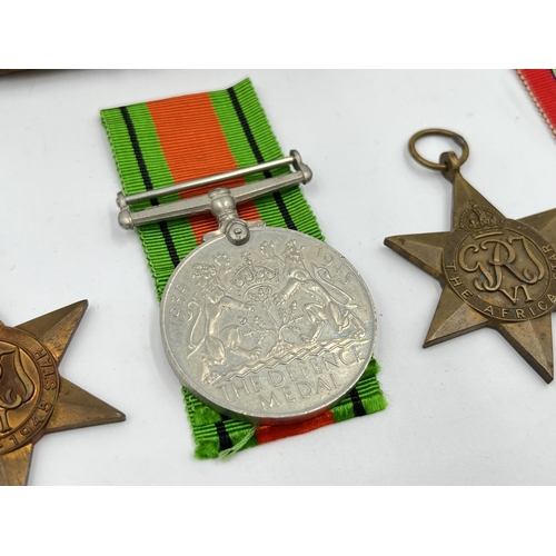 2290 - Four WWII medals, The Defence, The 1939-1945 Star, The Italy Star and The Africa Star with document ... 