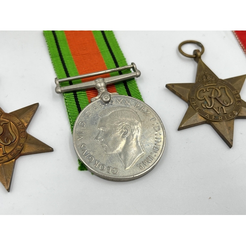 2290 - Four WWII medals, The Defence, The 1939-1945 Star, The Italy Star and The Africa Star with document ... 