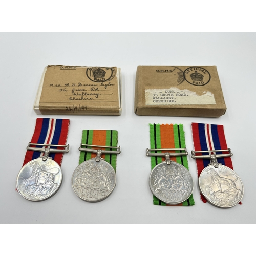 2291 - Four WWII medals, two Defence and two War with two boxes and documents