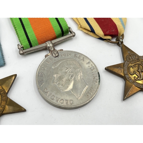 2294 - Five WWII medals, The Defence, The 1939-1945 Star, The France and Germany Star, The Italy Star and T... 