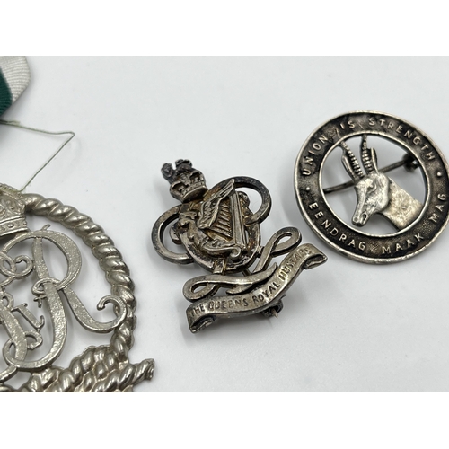 2297 - Three military items, two hallmarked sterling silver cap badges and one Royal Naval Volunteer reserv... 