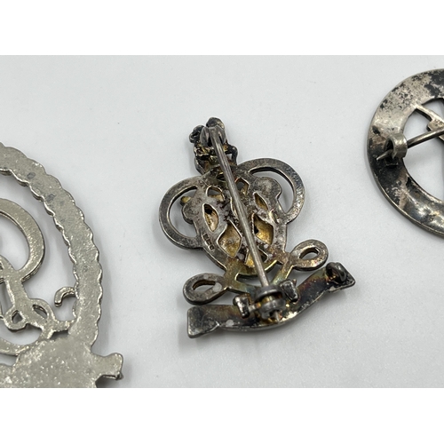 2297 - Three military items, two hallmarked sterling silver cap badges and one Royal Naval Volunteer reserv... 