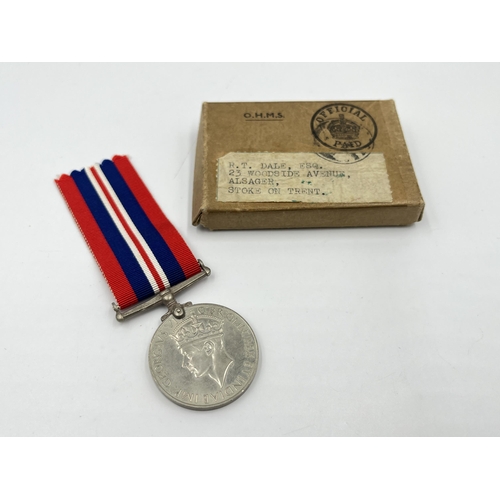 2306 - A WWII War medal with box issued to R.T. Dale. ESQ. 23 Woodside Avenue, Alsager, Stoke-On-Trent