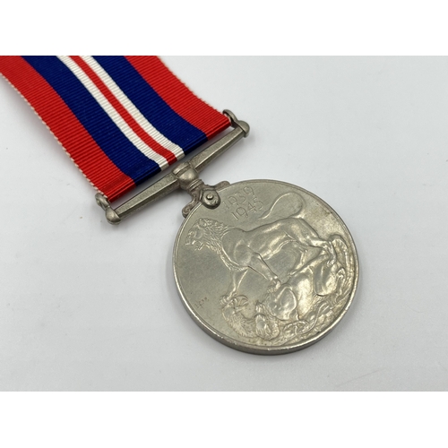 2306 - A WWII War medal with box issued to R.T. Dale. ESQ. 23 Woodside Avenue, Alsager, Stoke-On-Trent